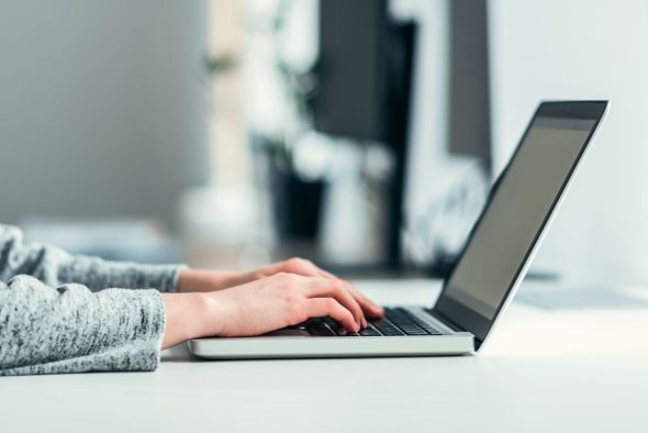 hotelier looking for squarespace booking system on laptop