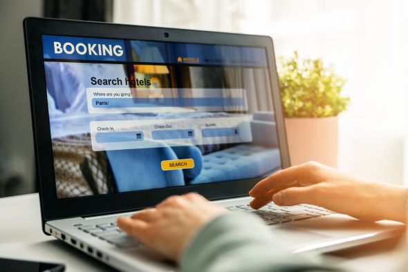 small hotel manager looking at hotel search engines