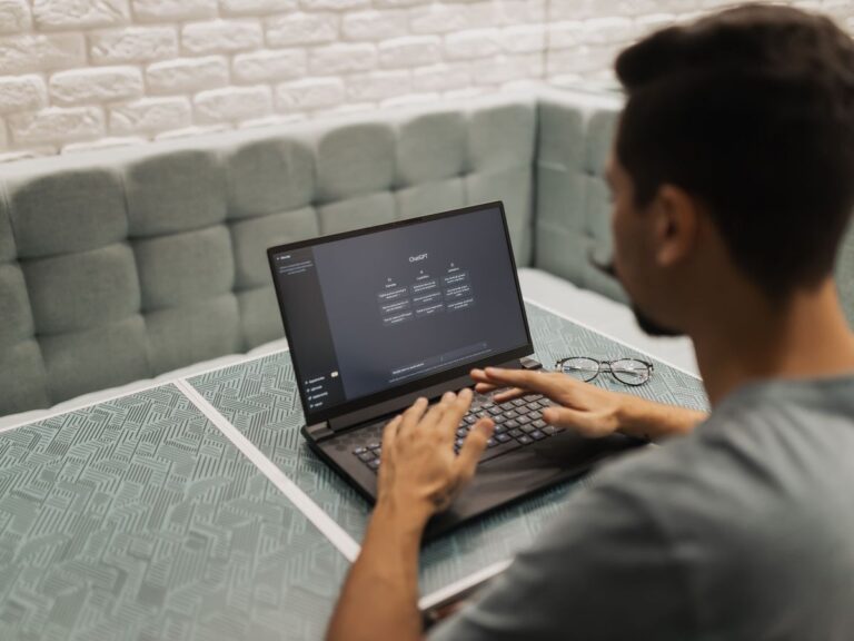 Man using chatGPT on laptop